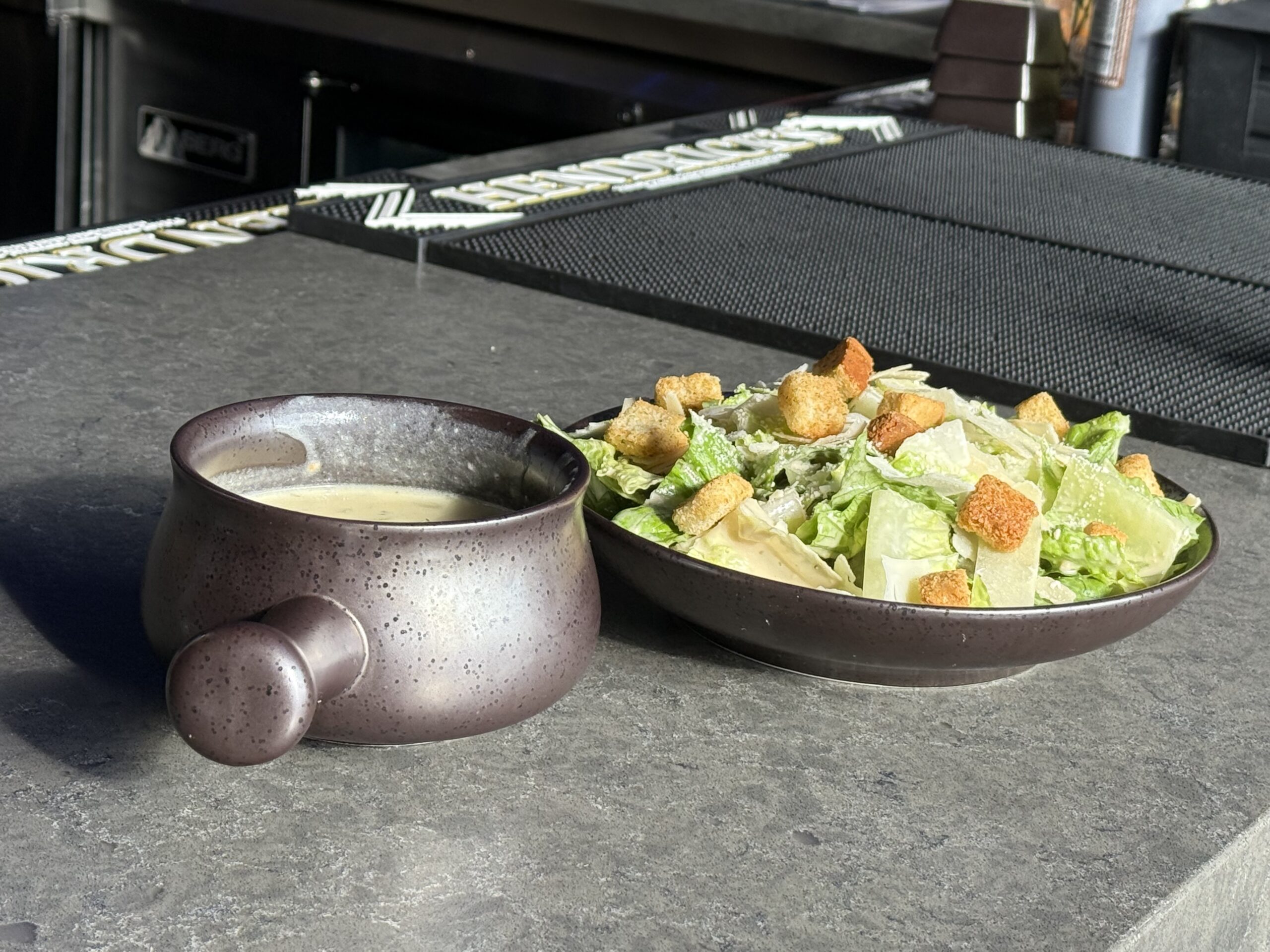 Caesar salad and cup of soup